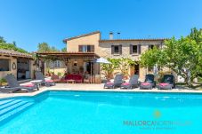 Private swimming pool with sun loungers in front of Ca na Pereta traditional villa in Pollensa