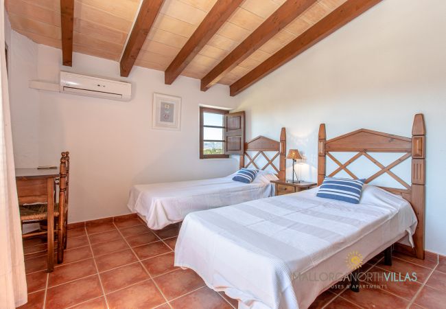 Twin bedroom with air conditioning and countryside view Twin bedroom with two single beds, air conditioning and countryside views.