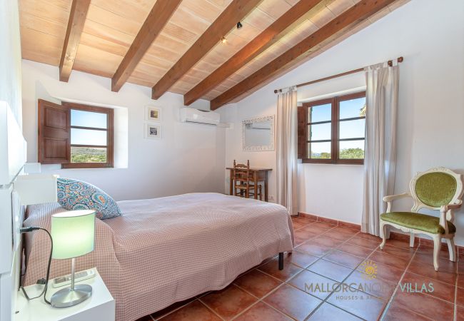Double bedroom with large bed and air conditioning Bright double bedroom with a large bed, air conditioning and countryside views.