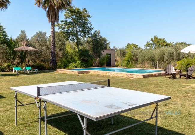 Garden with ping pong table and private pool in finca Ping pong table in the garden next to private pool in holiday finca Mallorca