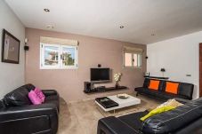 Living/dining room with 3 sofas for two people each