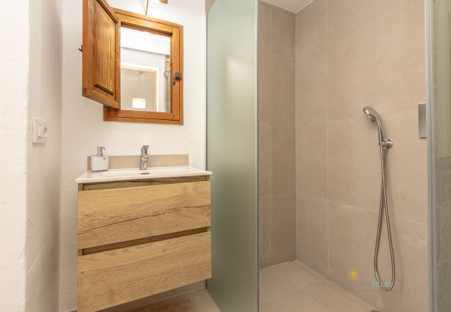 La Sort Llarga Bathroom – Shower and vanity in Pollença Bathroom with shower and wooden vanity at La Sort Llarga, Pollença