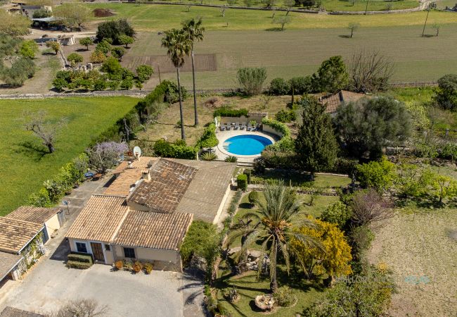 Aerial views of La Sort Llarga with pool in Pollença House and pool at La Sort Llarga surrounded by countryside