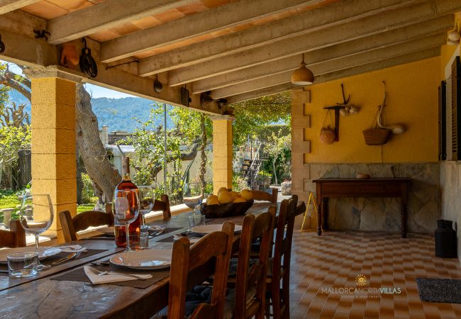 La Sort Llarga Terrace – Outdoor dining in Pollença Dining table on outdoor terrace with garden views at La Sort Llarga, Pollença