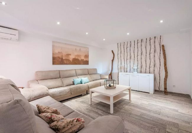 Spacious living room with smart TV and fireplace Spacious living room with smart TV and fireplace