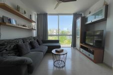 Modern living room at Llenaire Apartment in Port de Pollença with large window, Smart TV and open views.